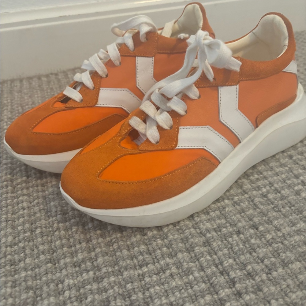 Culture of brave orange sneaker